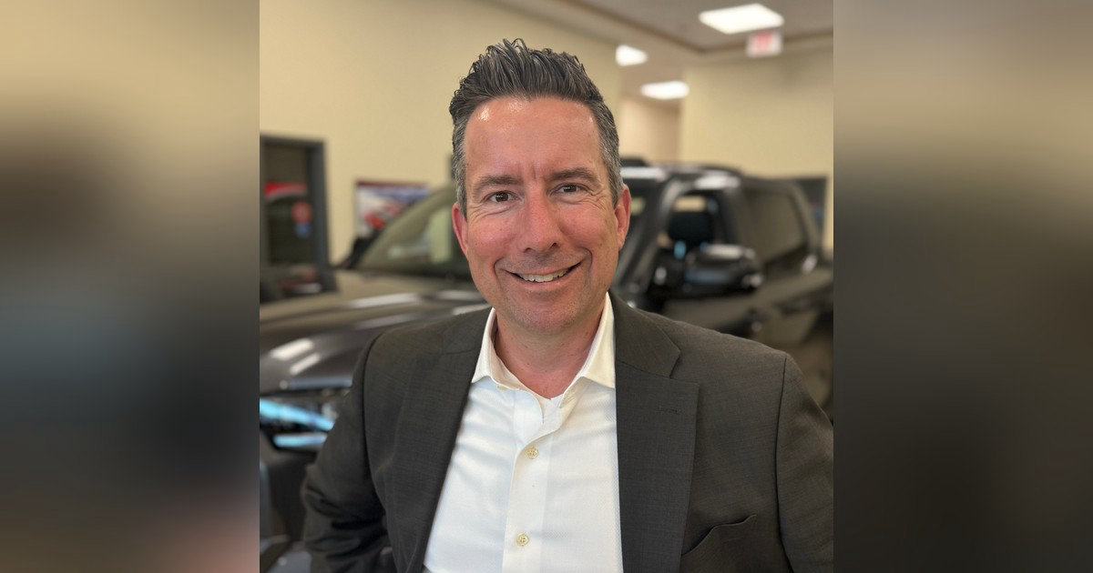 Mike Hochwald, Product Adviser at Toyota Plaza, smiling in the showroom